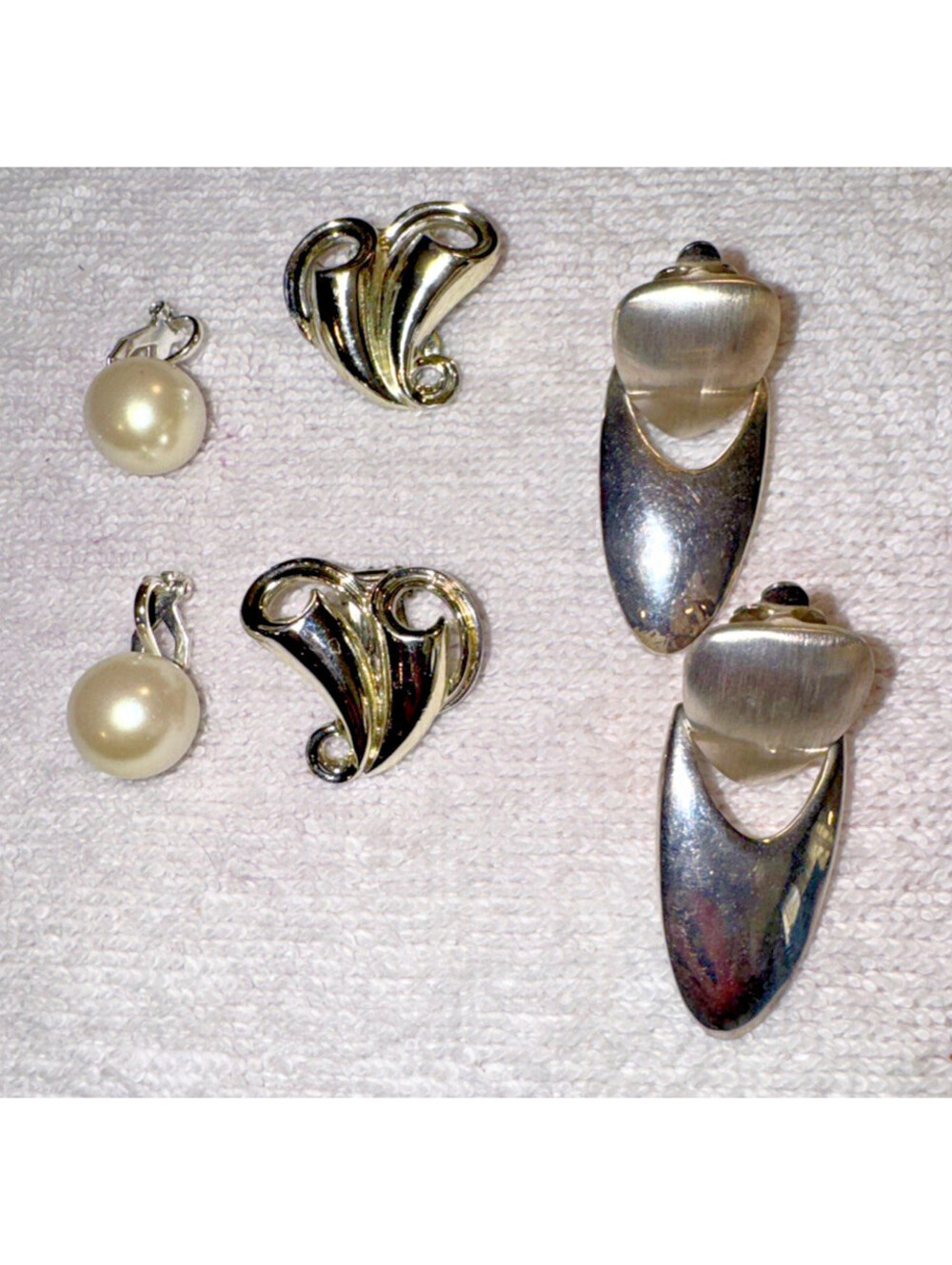 Three pair silvertone clip On earrings heart pearl